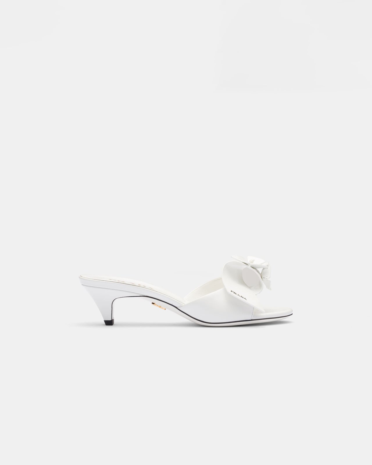 Bianco patent leather heeled mules with prada logo